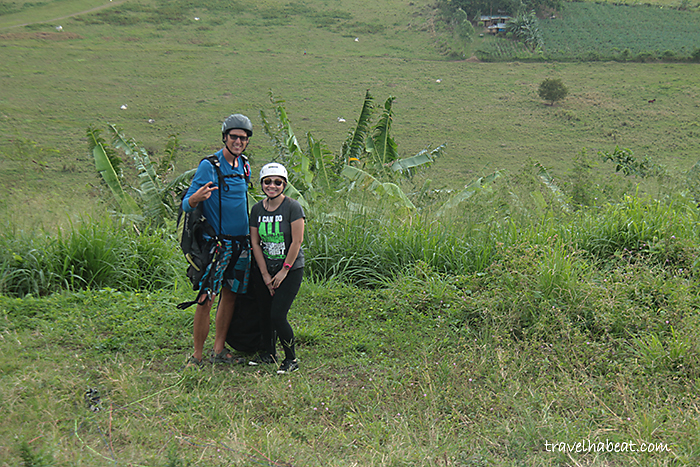 With paragliding pilot.