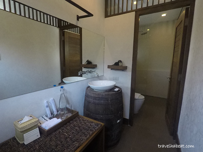 Bathroom with earth tone scheme and native crafts.