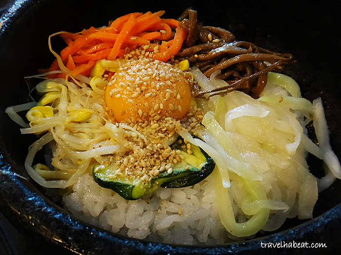 Bibimbap topped with raw egg.